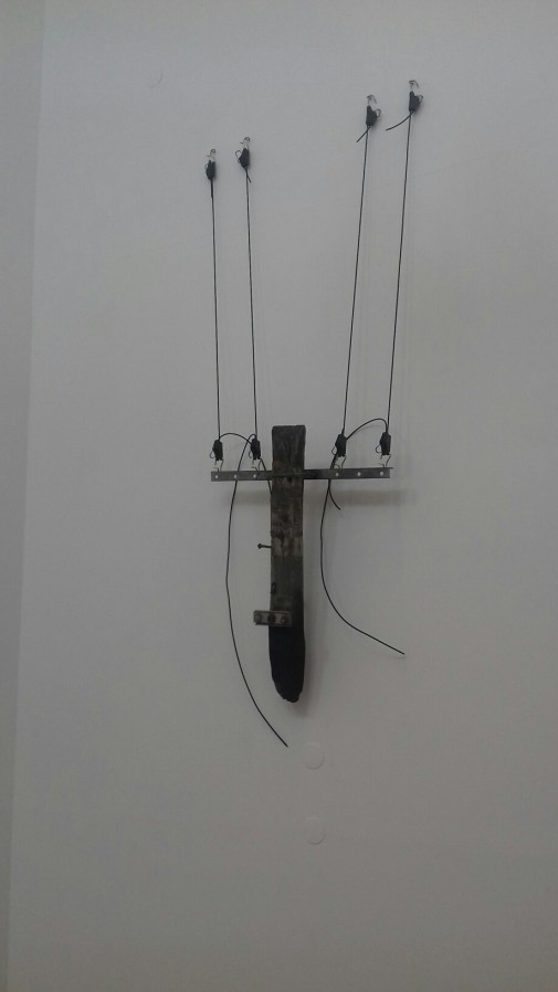 Cross, 2017/2019, Telephone pole and wires, Variable dimensions (view of the work in the exhibition "Impass", SNBA - National Society of Fine Arts, Lisbon, August 2019)